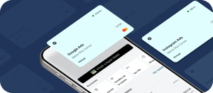 Teléfono mostrando tarjetas virtuales de Mastercard para Google Ads e Instagram Ads con opción de añadir a Apple Wallet.